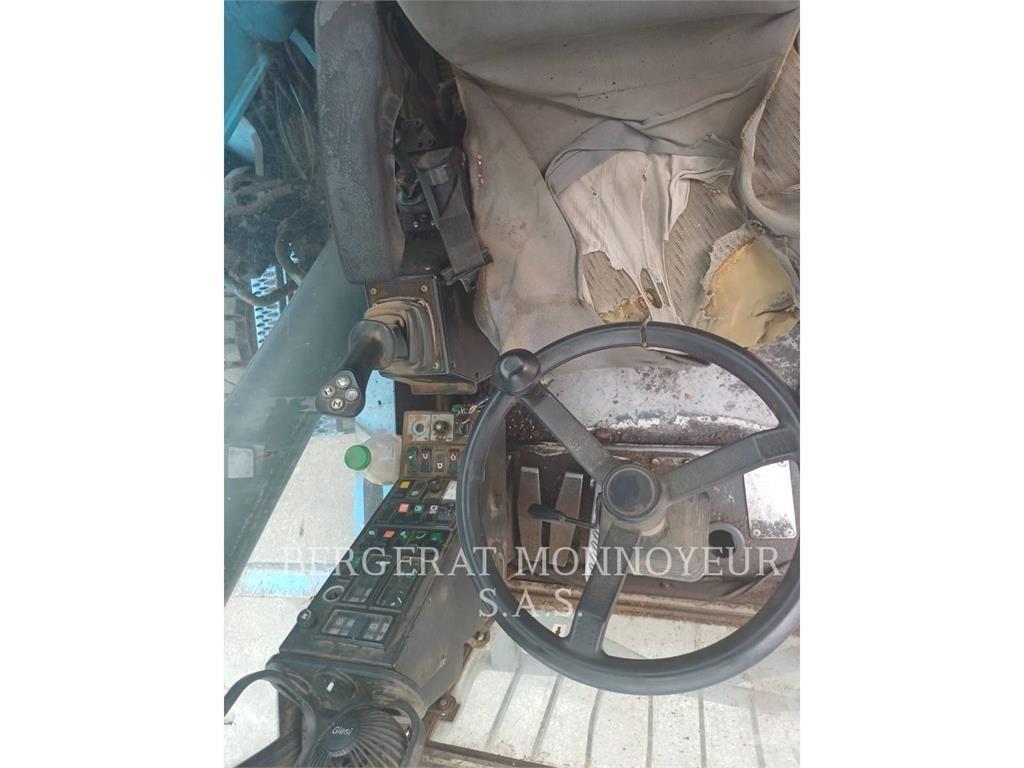 Fuchs MHL320 حفارات بعجل