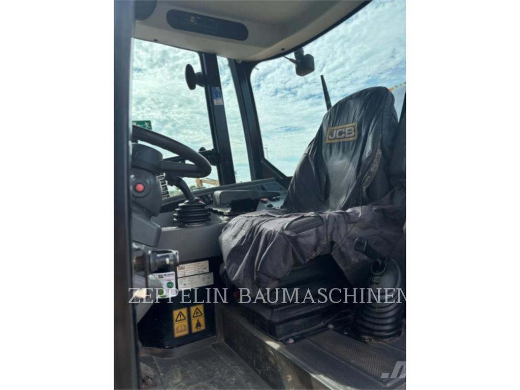 JCB 409 لوادر بعجل