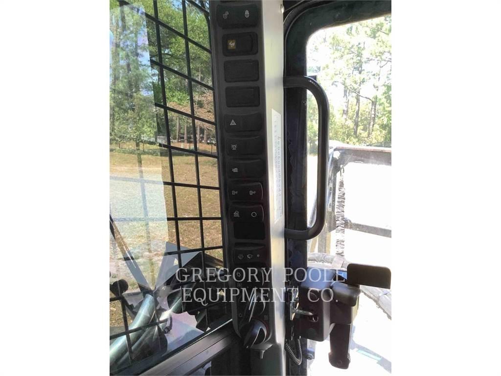 New Holland C345 لوادر زحافة