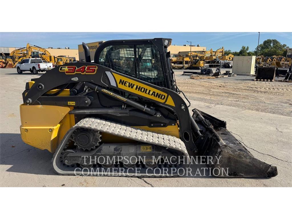 New Holland C345 لوادر زحافة