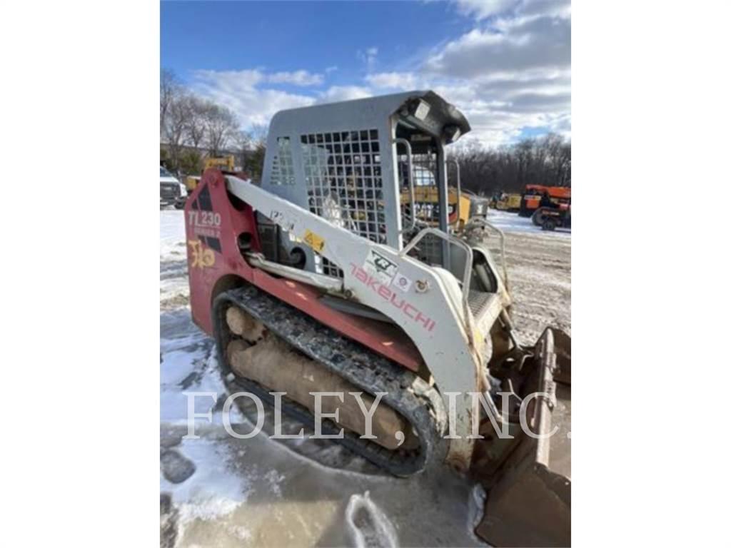 Takeuchi TL230 لوادر زحافة