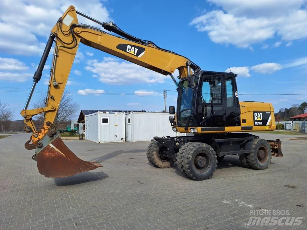 CAT M 316 D حفارات بعجل
