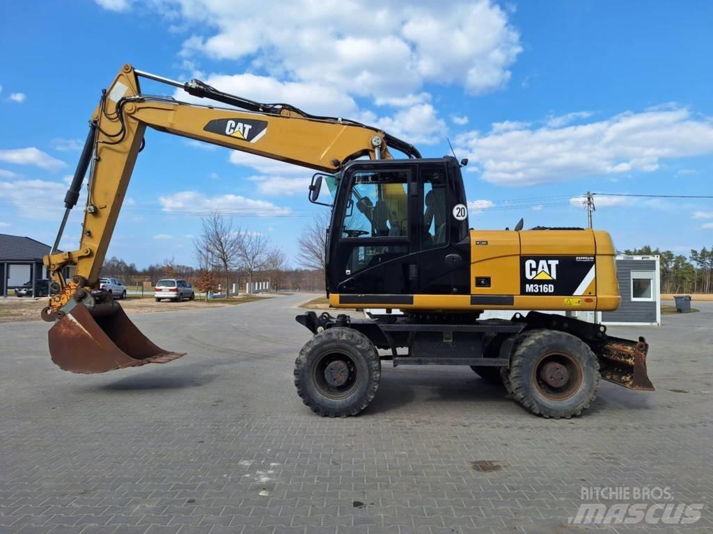 CAT M 316 D حفارات بعجل