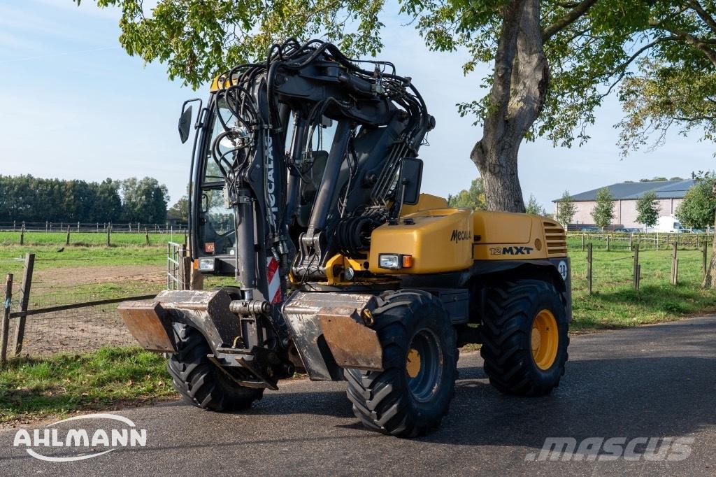 Mecalac 12 MXT حفارات بعجل