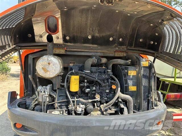 Doosan DX55 حفارات بعجل