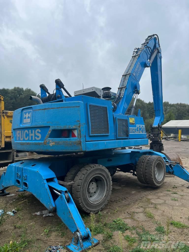 Fuchs MHL 320 حفارات بعجل