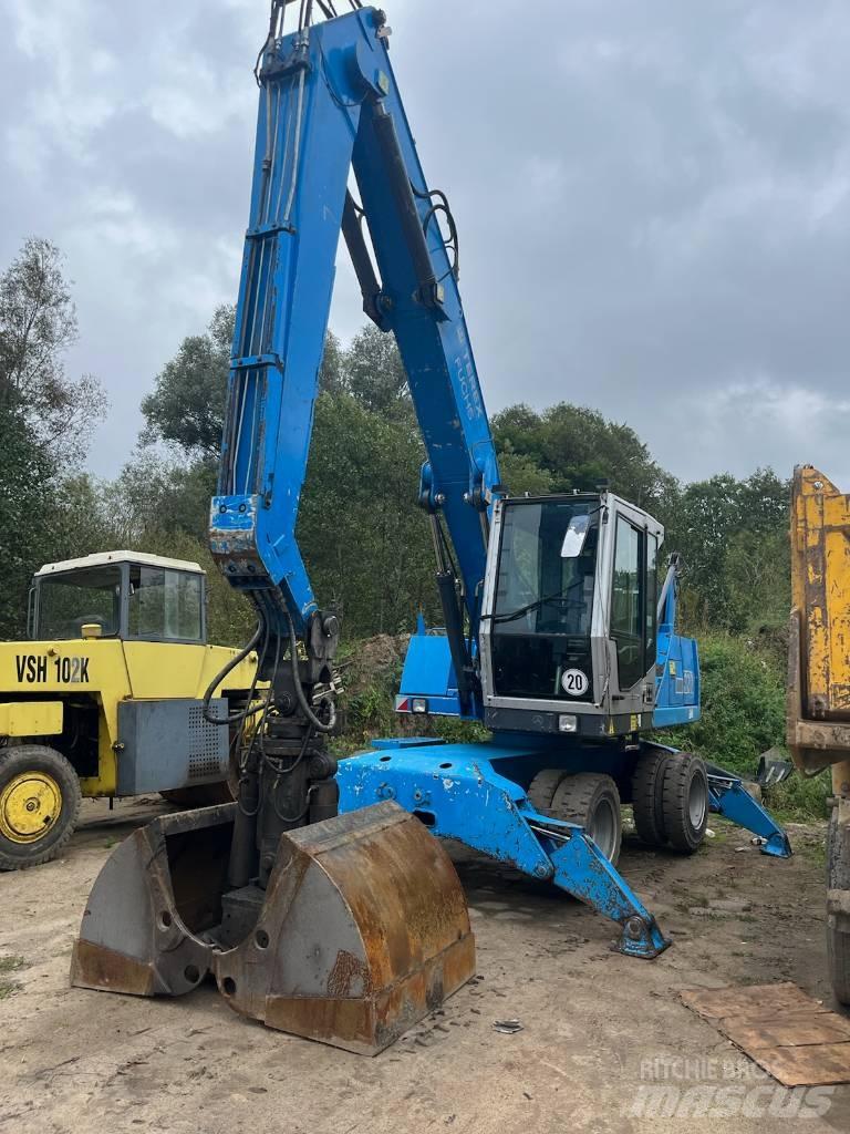 Fuchs MHL 320 حفارات بعجل
