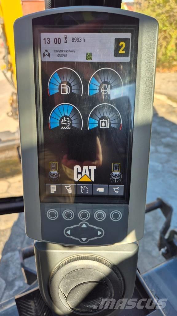 CAT M 313 D حفارات بعجل