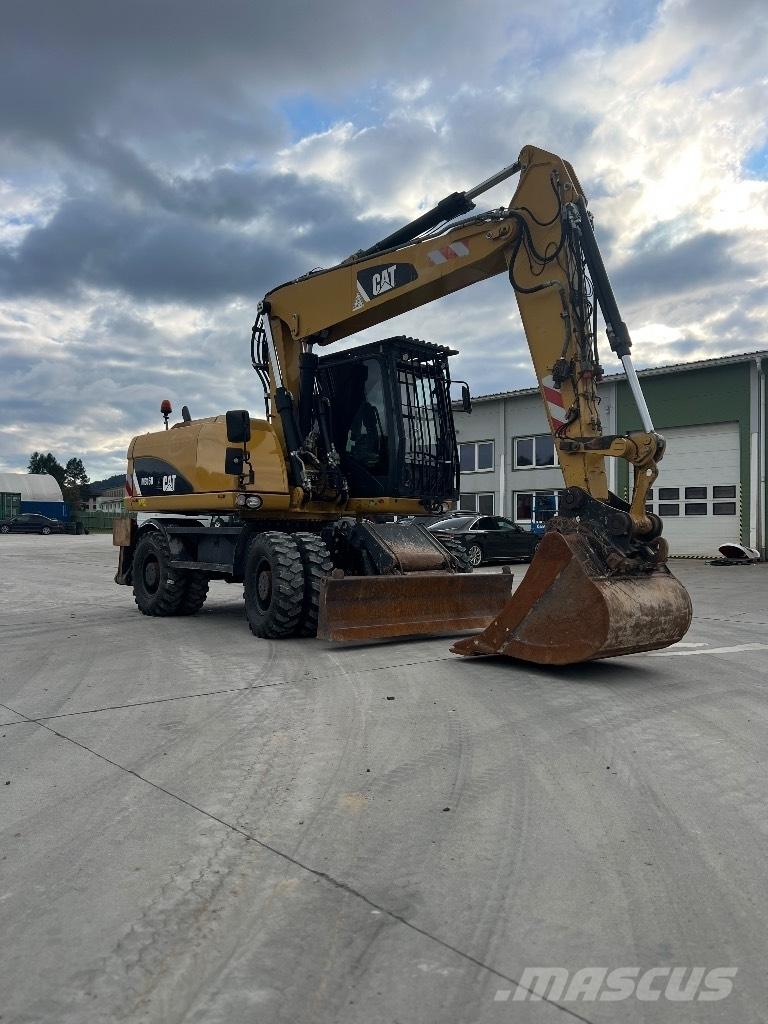 CAT M 316 D حفارات بعجل