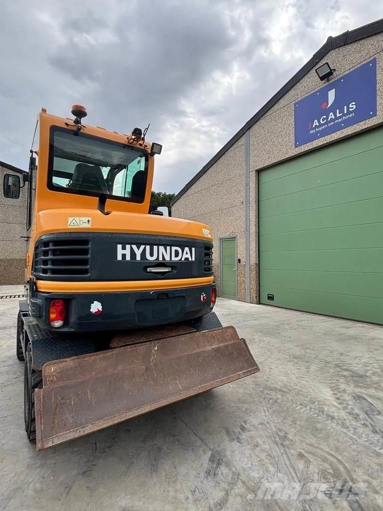 Hyundai R55W-9A حفارات بعجل
