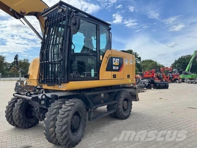 CAT M 318 F حفارات بعجل