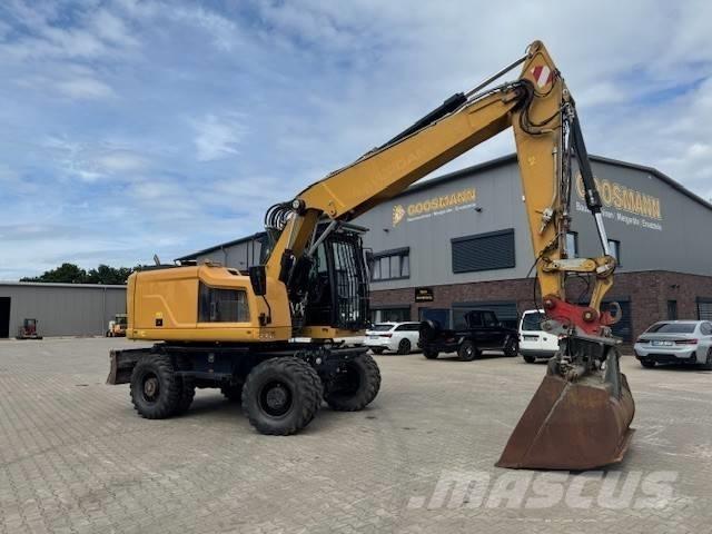 CAT M 318 F حفارات بعجل