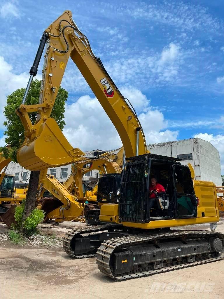 CAT 323 حفارات وسط 7 طن - 12 طن