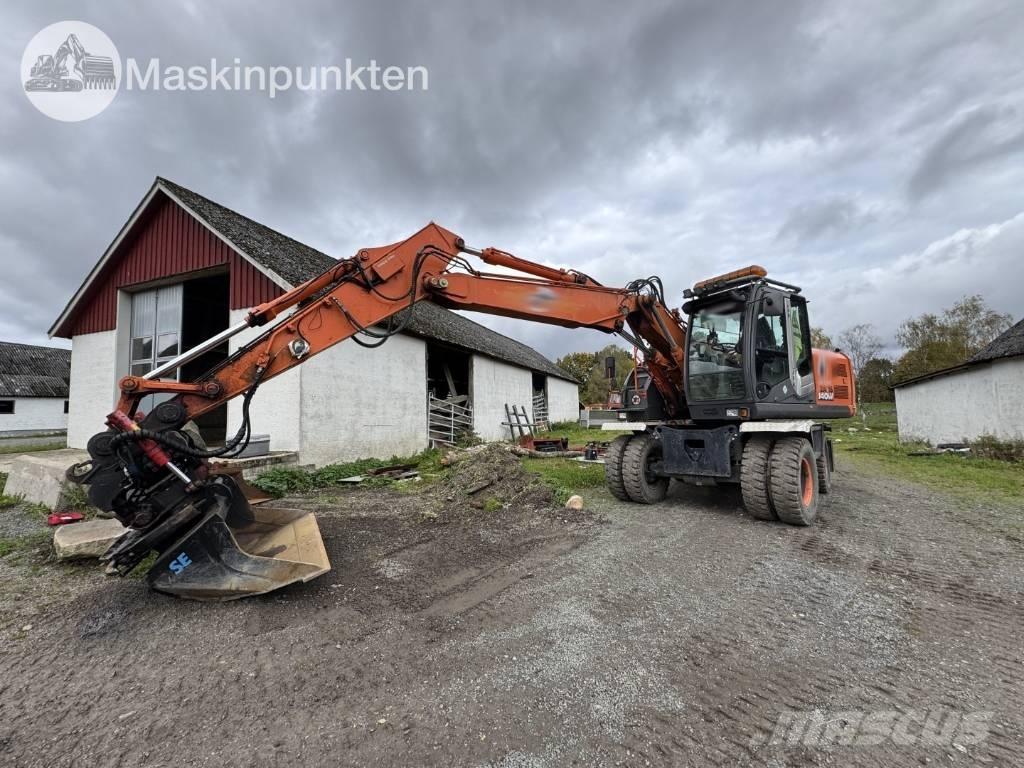 Hitachi ZX 140 W-3 حفارات بعجل