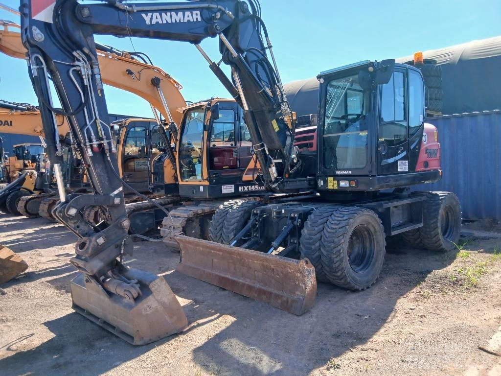 Yanmar B 110 W حفارات بعجل
