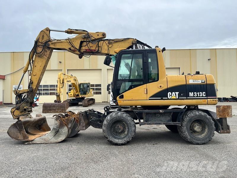 CAT M313C حفارات بعجل