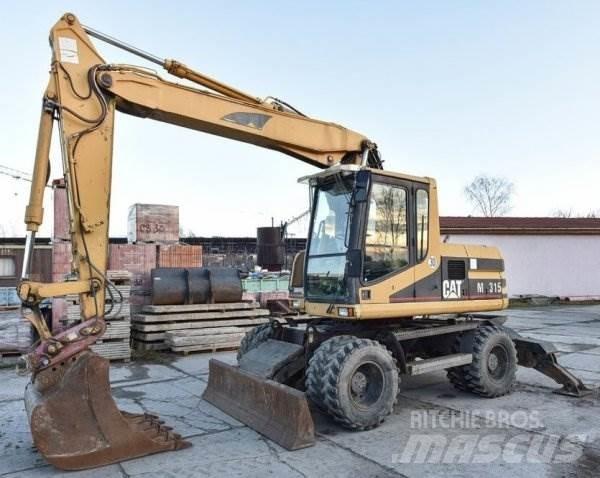CAT M 315 حفارات بعجل