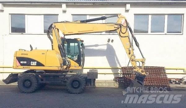 CAT M 315 D حفارات بعجل