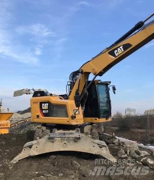 CAT M317 F حفارات بعجل