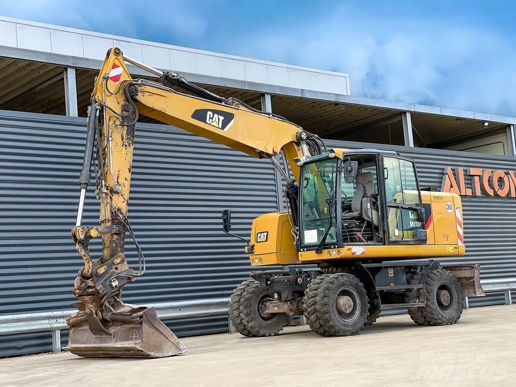 CAT M318F حفارات بعجل
