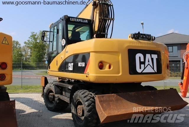 CAT M 315 D حفارات بعجل