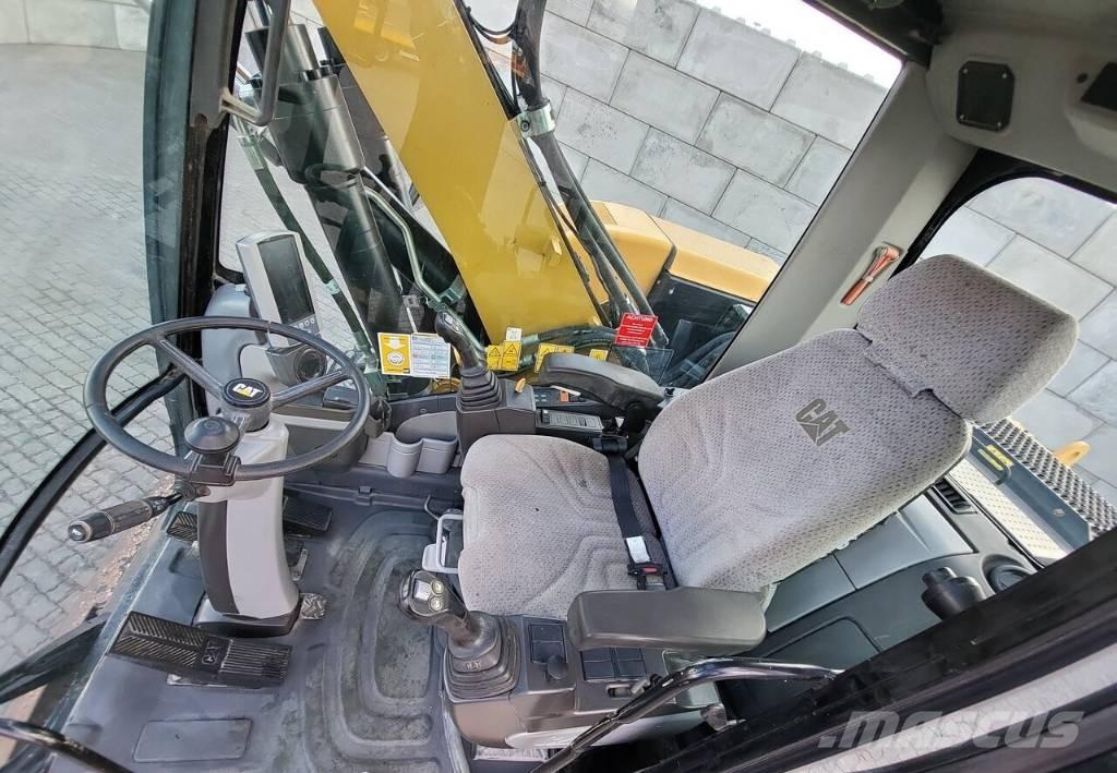 CAT M313 D حفارات بعجل