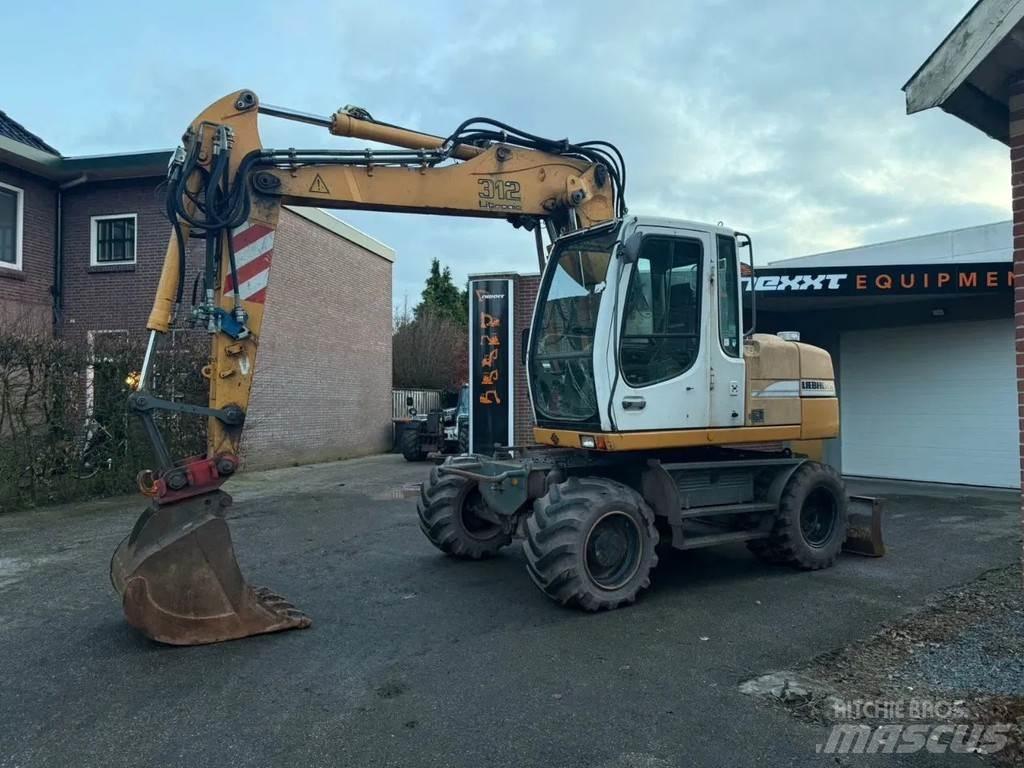 Liebherr A312 حفارات بعجل