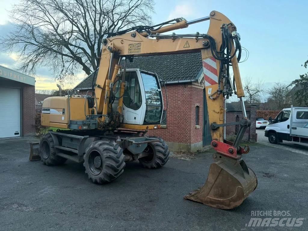 Liebherr A312 حفارات بعجل