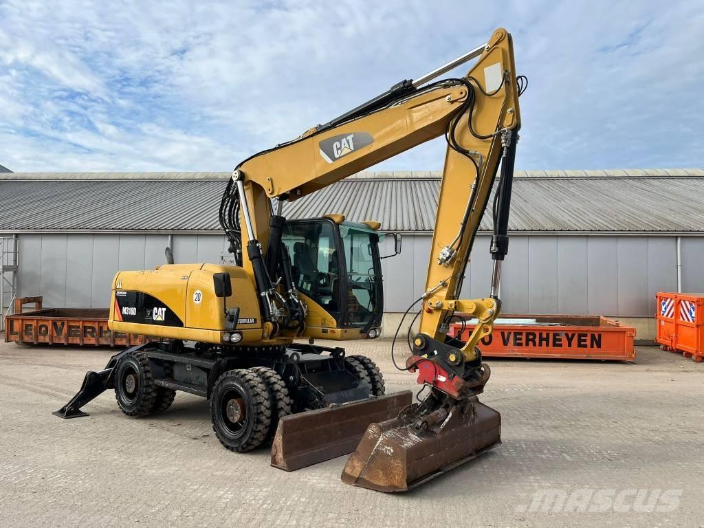 CAT M 318 D حفارات بعجل