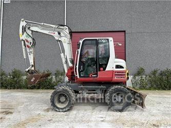 Takeuchi TB295W حفارات بعجل