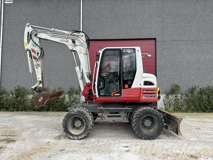Takeuchi TB295W حفارات بعجل