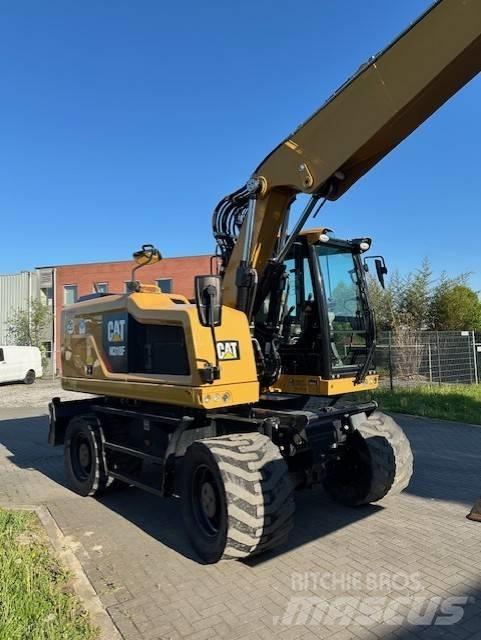 CAT M 318 F حفارات بعجل