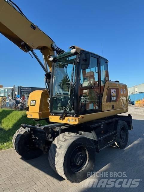 CAT M 318 F حفارات بعجل