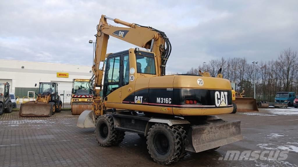 CAT M 316 C حفارات بعجل