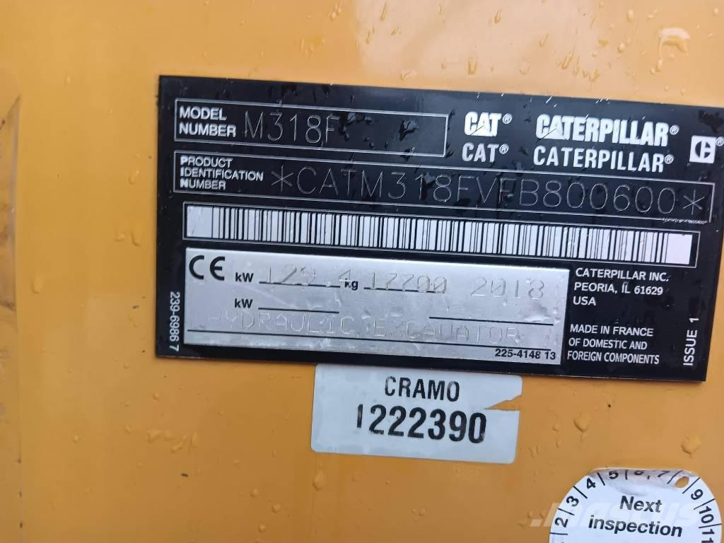 CAT M 318 F حفارات بعجل