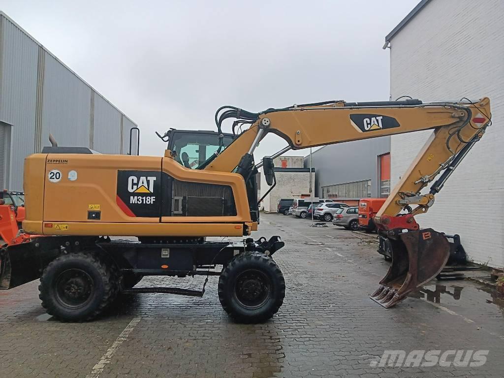 CAT M 318 F حفارات بعجل