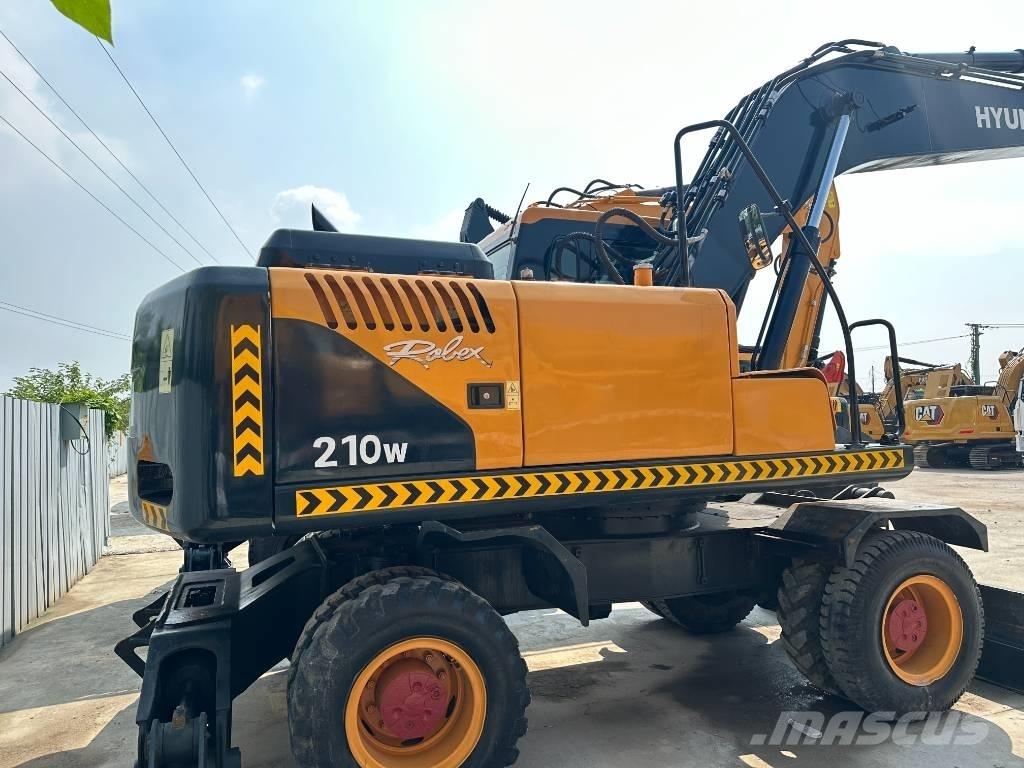 Hyundai 210W-9 حفارات بعجل