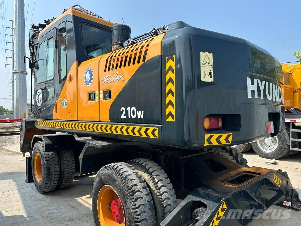 Hyundai 210W-9 حفارات بعجل