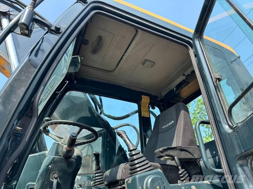 Hyundai 210W-9 حفارات بعجل