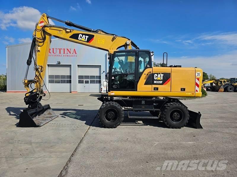 CAT M320F حفارات بعجل