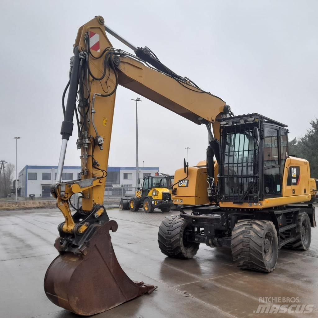 CAT M 318 F حفارات بعجل