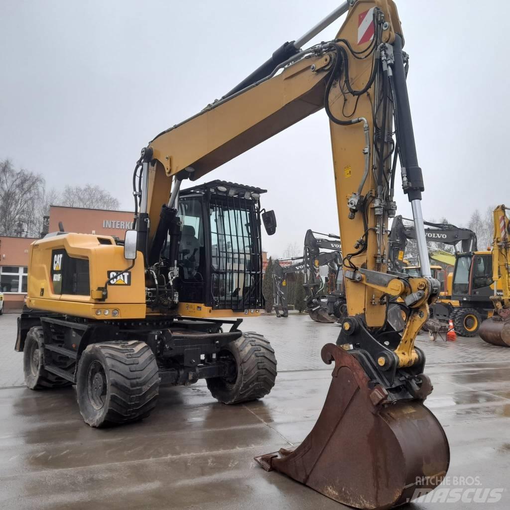 CAT M 318 F حفارات بعجل