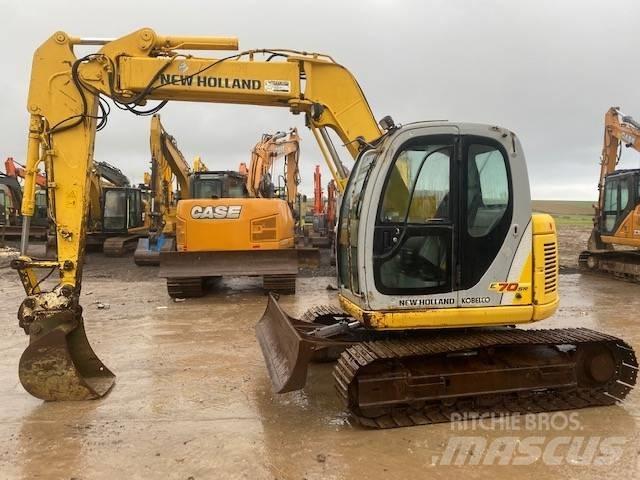 New Holland E 70 SR حفارات وسط 7 طن - 12 طن