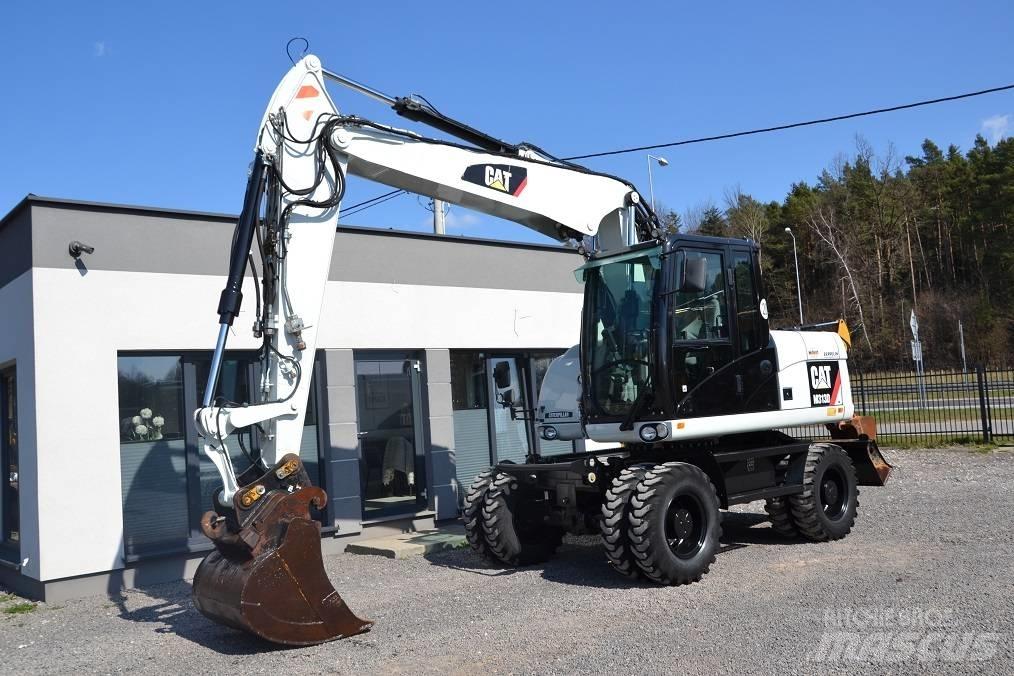 CAT M 313 D حفارات بعجل