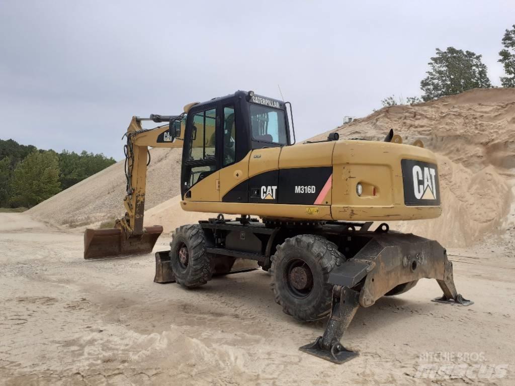CAT M 316 D حفارات بعجل