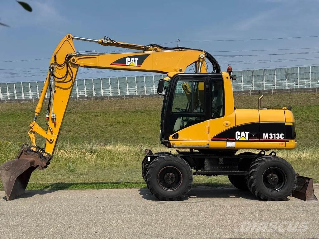 CAT M313C حفارات بعجل