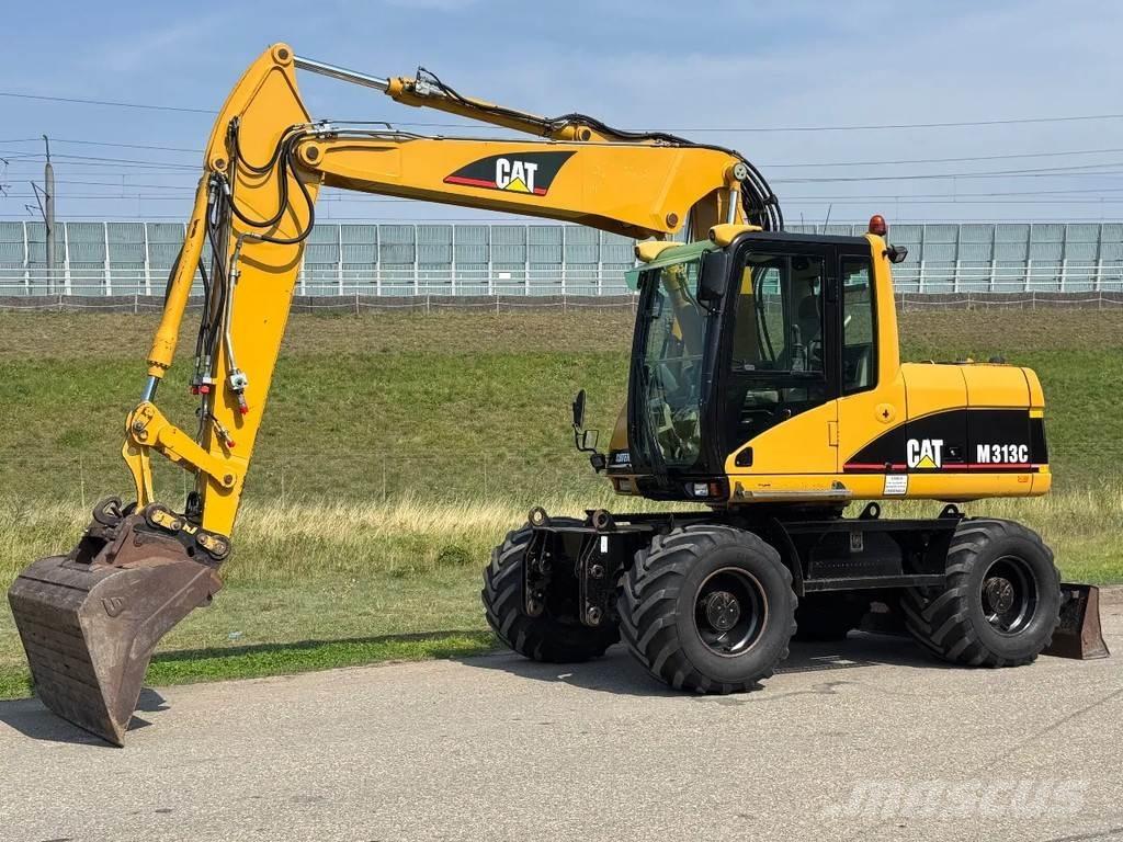 CAT M313C حفارات بعجل