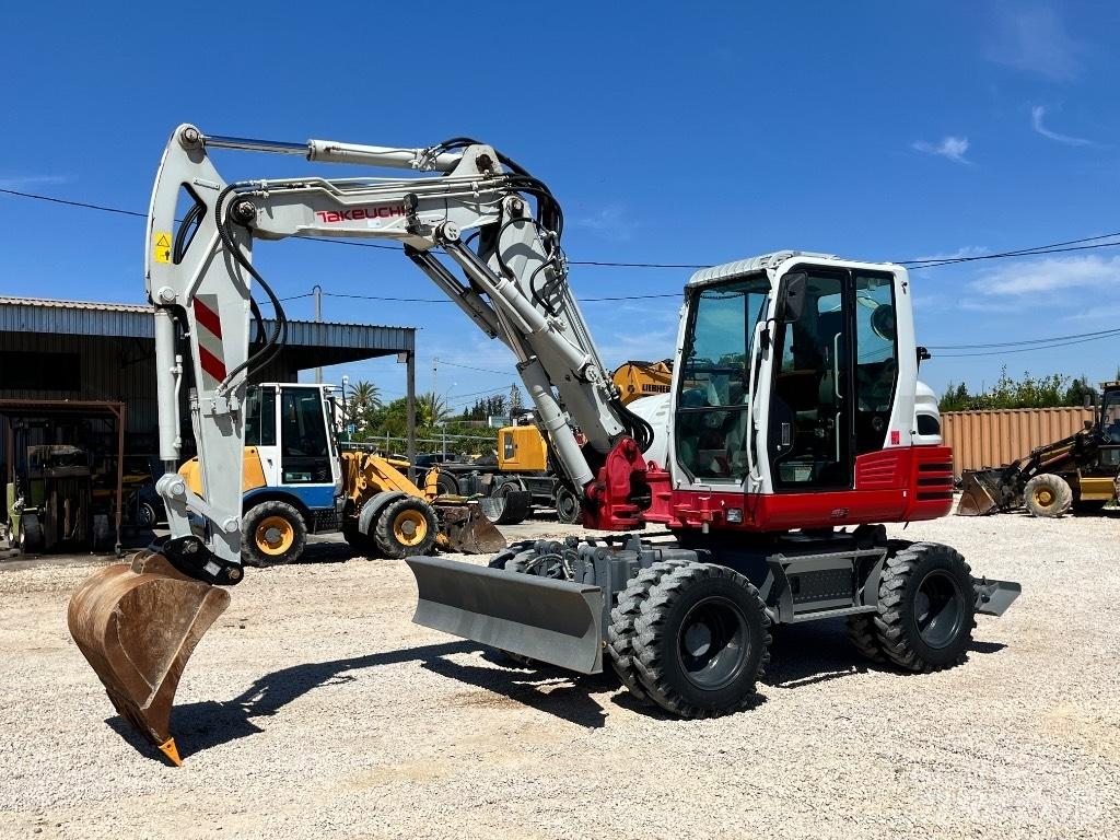Takeuchi TB 295 حفارات بعجل