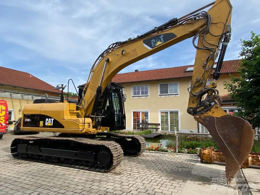 CAT 319 D L حفارات زحافة