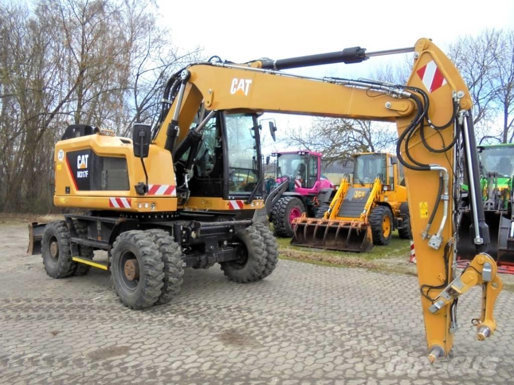 CAT M 317 حفارات بعجل